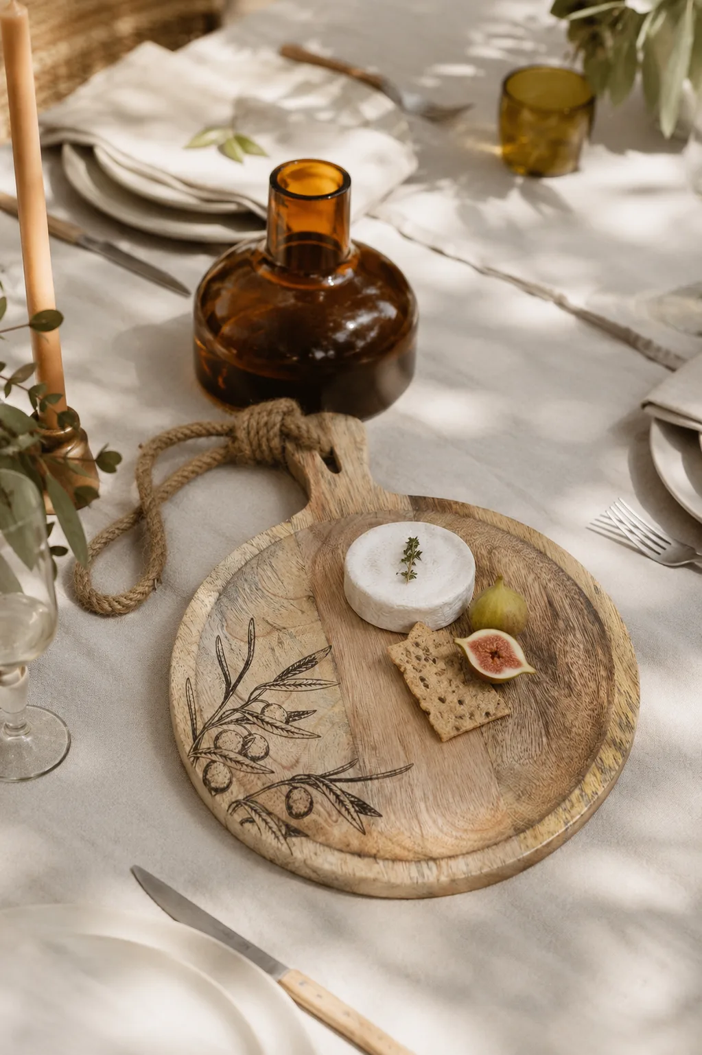 An engraved wooden serving board set for cheese and fruit