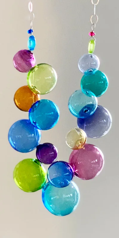 The Bubble necklace of clear colored glass beads