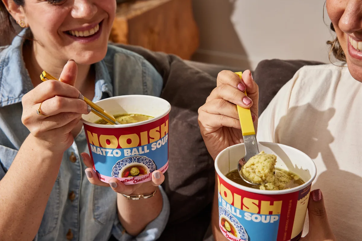 Sharing cups of NOOISH matzo ball soup