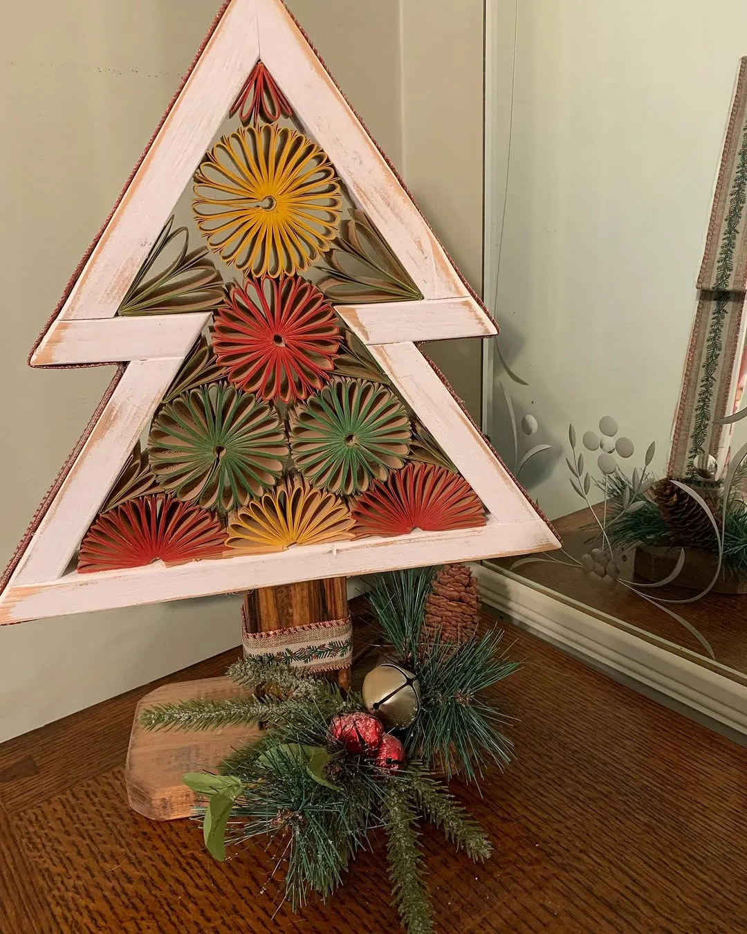Christmas tree made of repurposed wood and folded paperback book pages