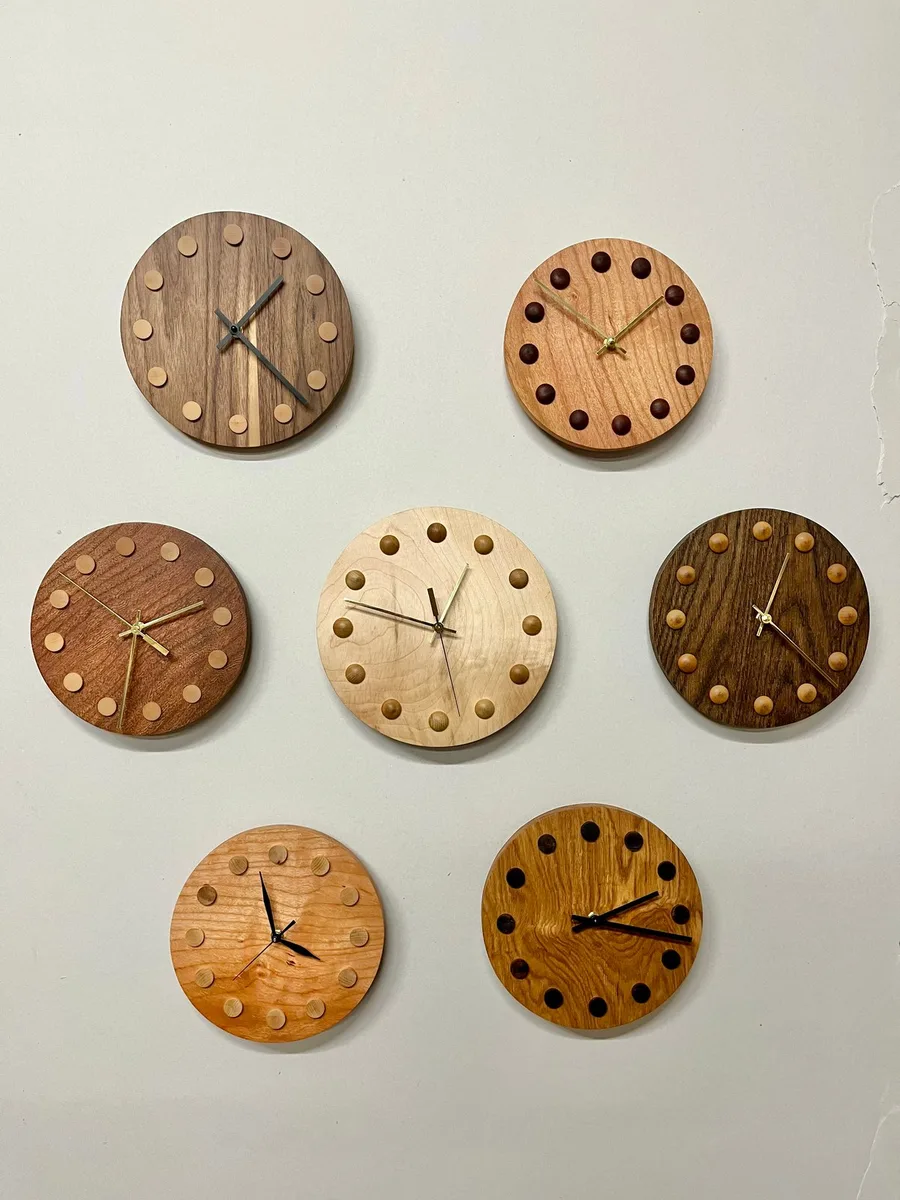 A wall of hardwood clocks