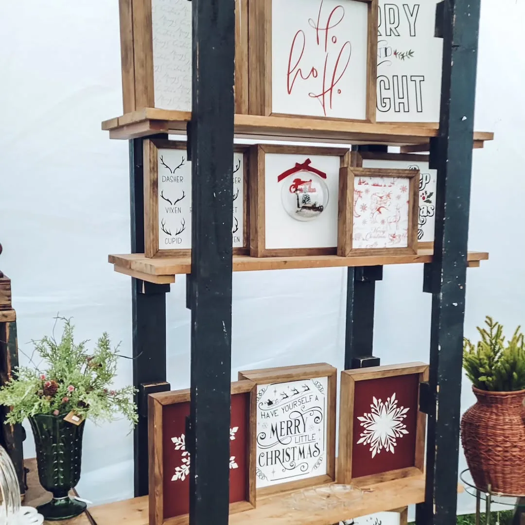 Shelves of small framed Christmas signs