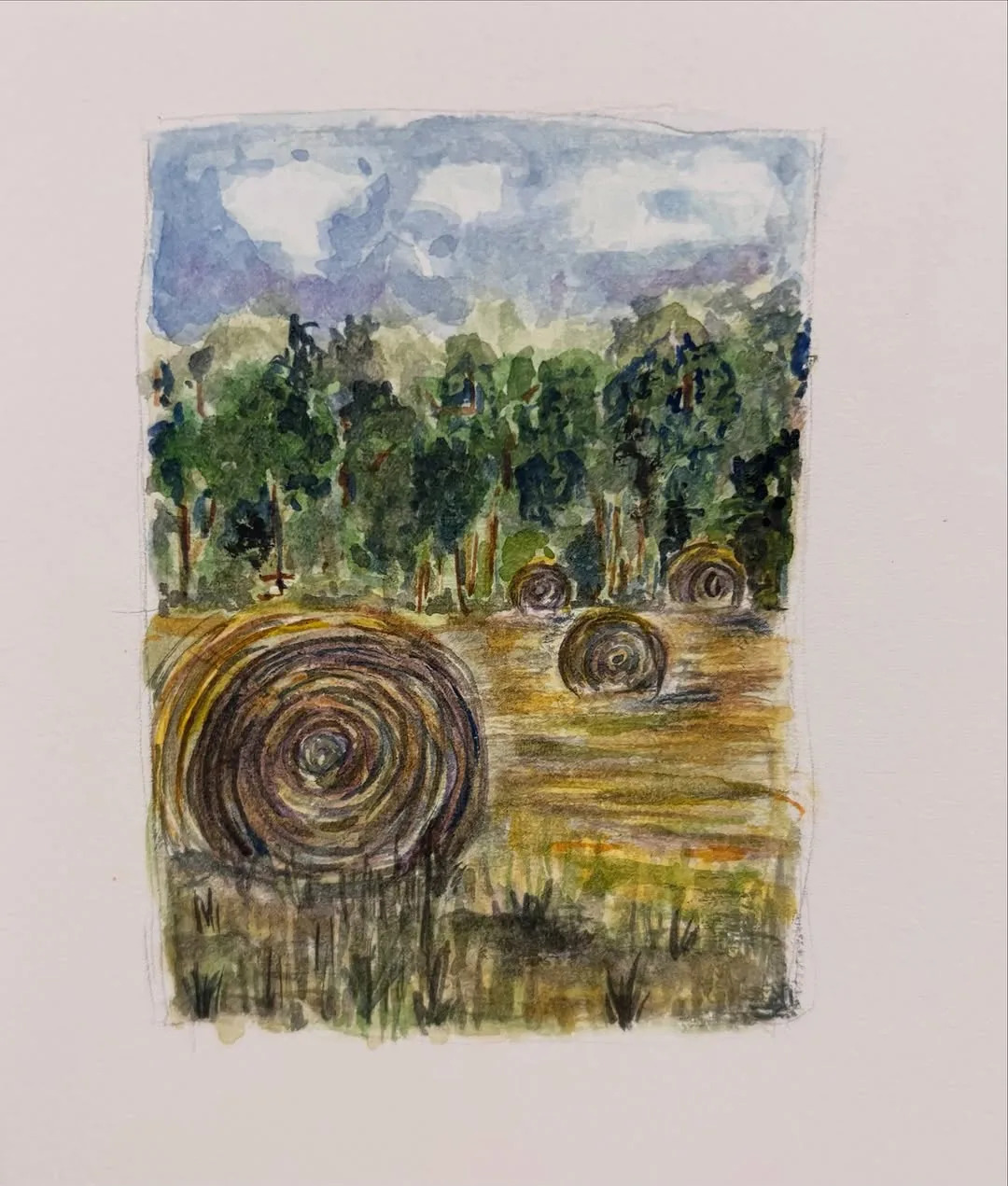 Watercolor of round hay bales in a field