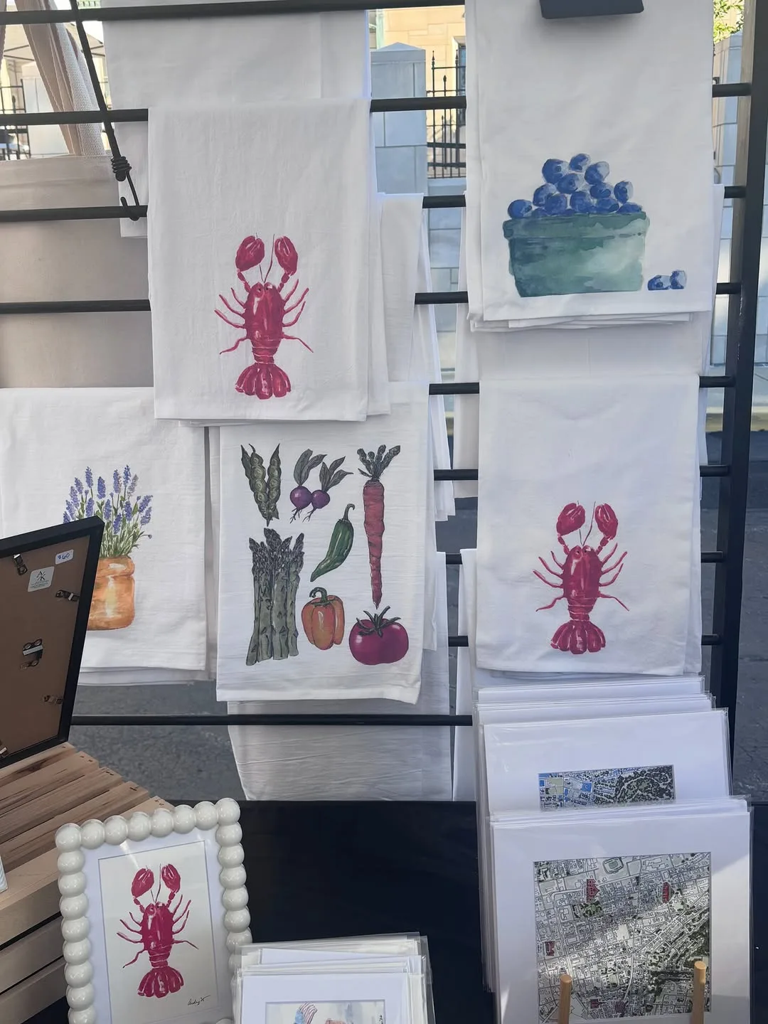 Tea towels printed with lobster, blueberry and vegetable watercolors
