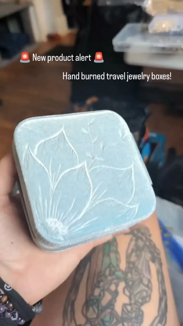 A hand-burned travel jewelry box